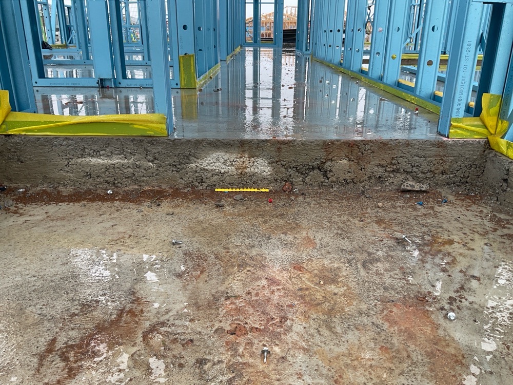 Honeycombing along the slab edge, noted during a frame inspection in Melton South