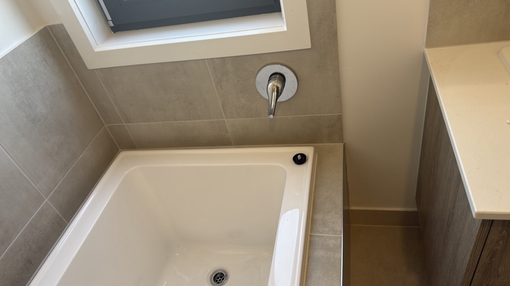 Water hammer heard when taps are turned on and off, noted during a pre-handover inspection in Melton South